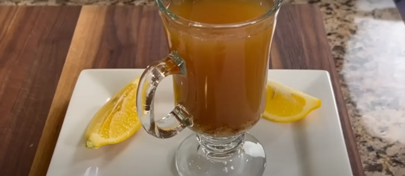 Easy flu bomb remedy ingredients including ginger, lemon, garlic, and honey