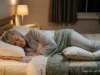 Older adult sleeping peacefully on their left side with a pillow between the knees
